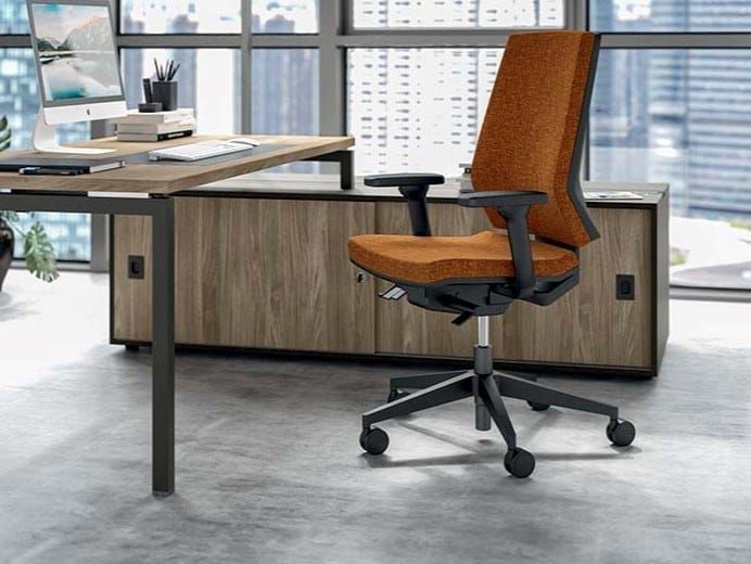 Modern burnt orange ergonomic office chair in a bright, minimalist workspace.